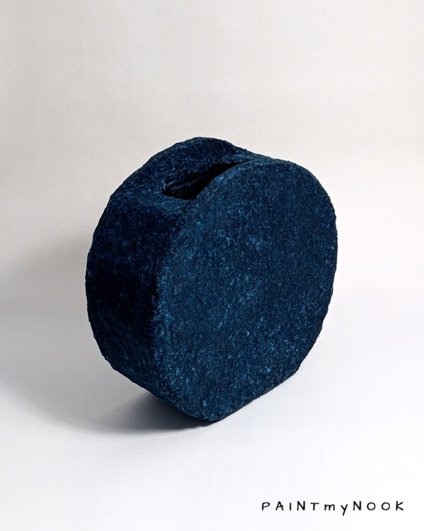indigo blue papier mache decorative vase with a circular shape