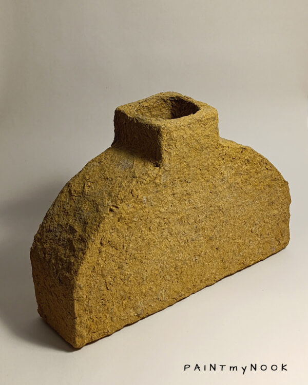 decorative vase made out of papier mache, in a mustard yellow color