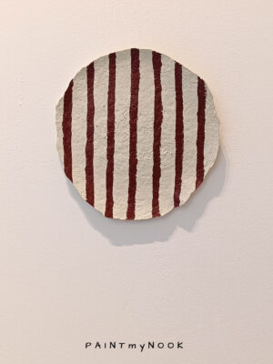 Russettas Stripes plate A paper mache decorative plate with red stripes painted on it