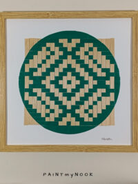 Framed wall decor featuring a green colored paperweaving pattern