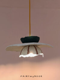A multi-colored paper mache lamp
