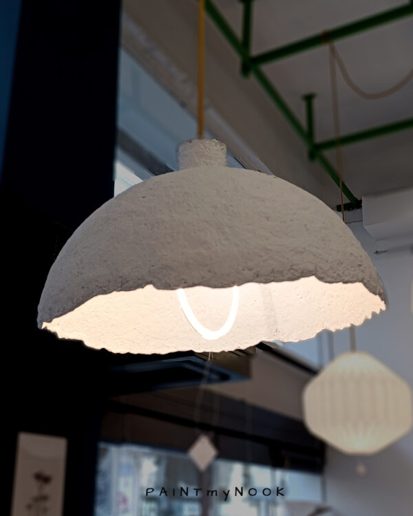 A white paper mache lamp