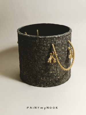 A planter cover in a granite grey color