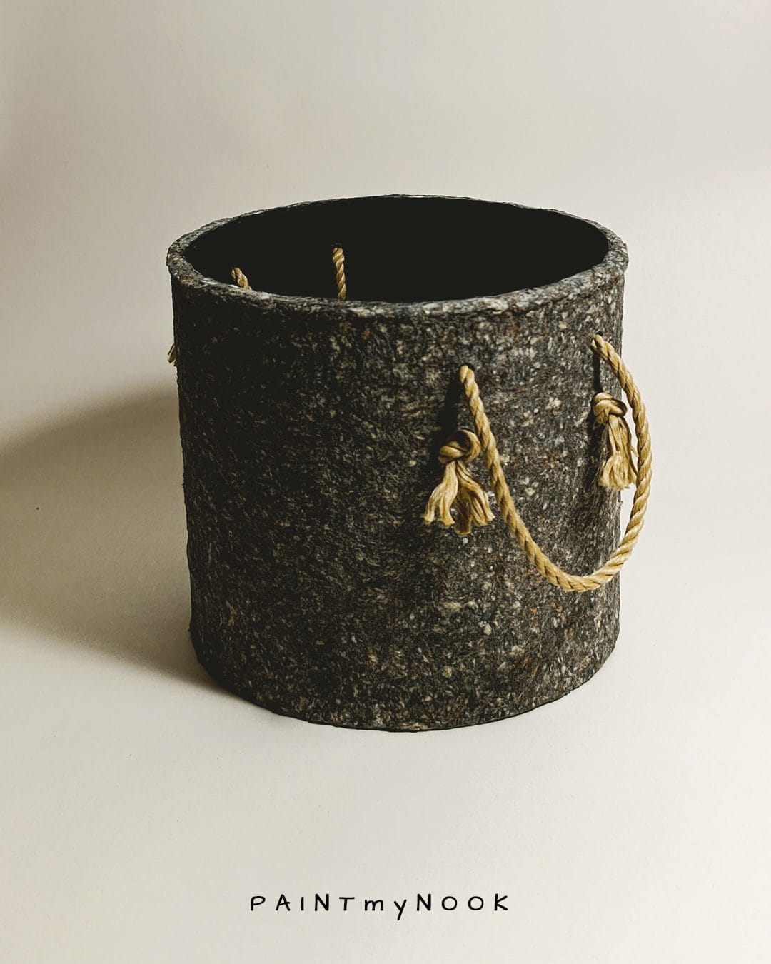 A planter cover in a granite grey color