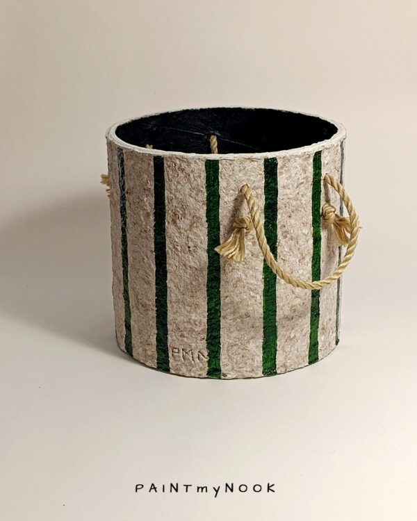 A green striped planter cover