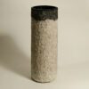 moon puddle vase A beige and grey cylindrical papier mache vase