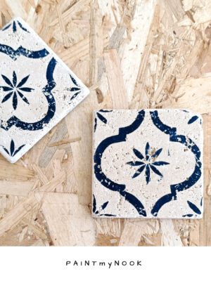 arabesque coaster A travertine tile coaster with a deep blue linocut print on