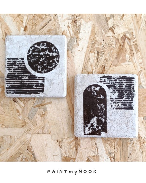 bauhaus coasters A pair of travertine tiles with a bauhaus style lino print on in a brown bistre color