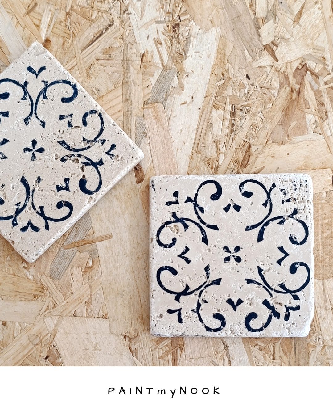 Travertine tile coaster with a floral pattern linoprint on in deep blue color