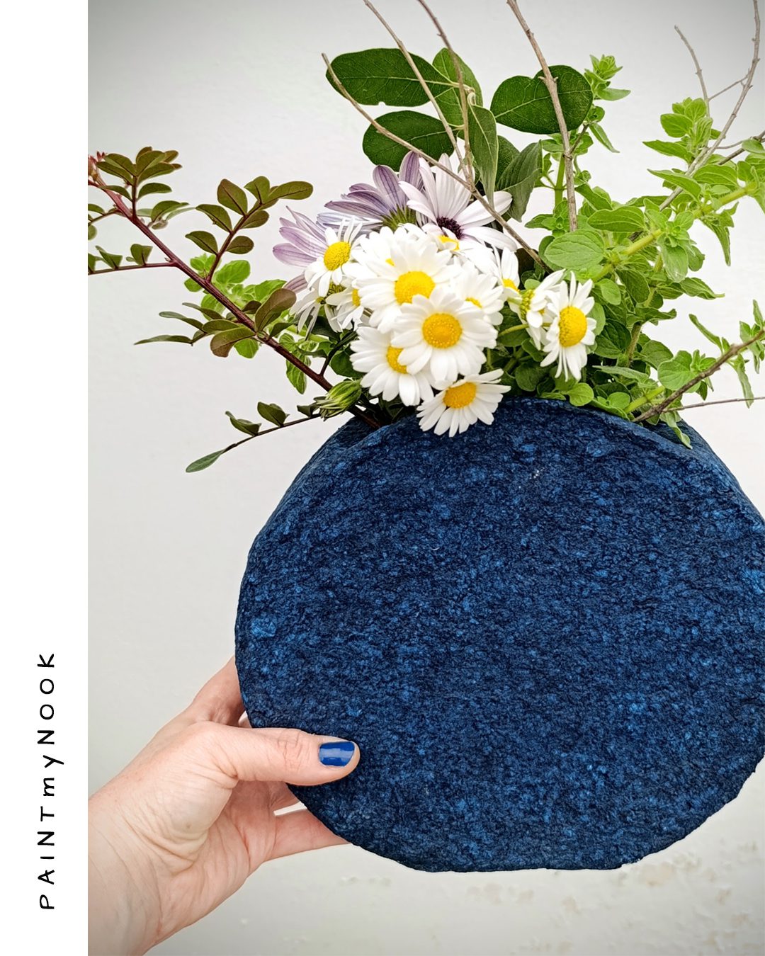 Indigo blue colored papier mache vase