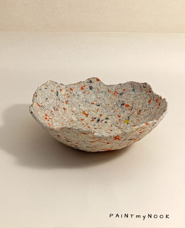Sunset bowl A beige papier mache bowl with orange details