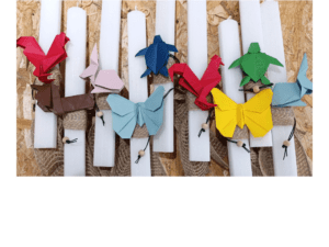 Easter candles with origami paper animals in various colors